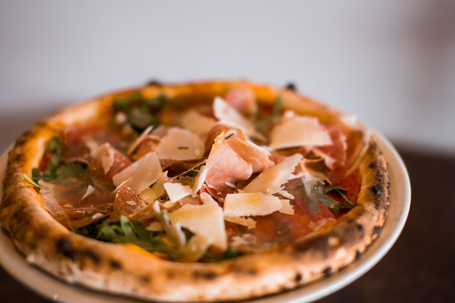White Pizza with Prosciutto di Parma, Fresh Arugula & Shaved Parmesan